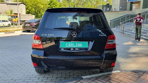 Сзади